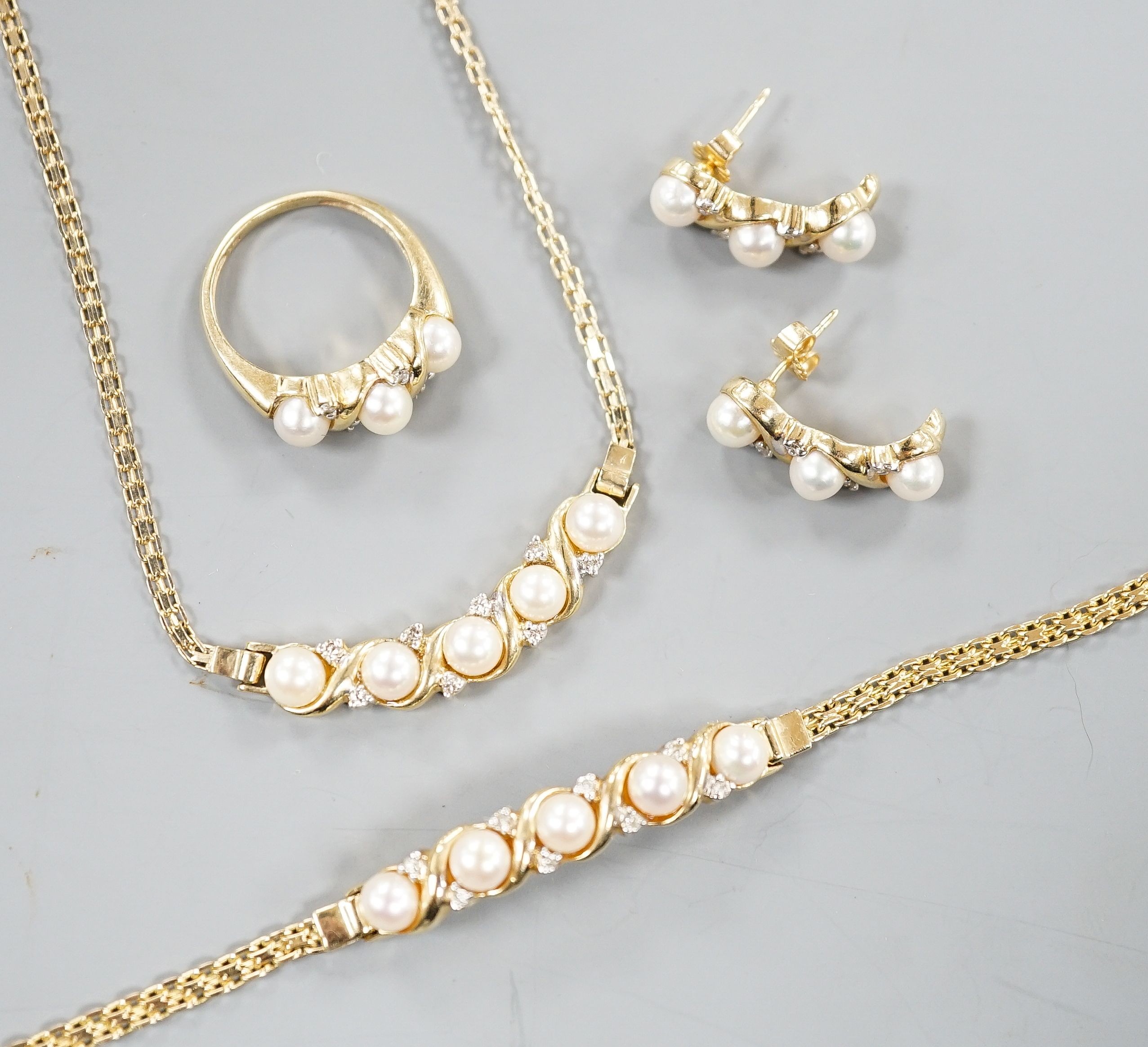 A modern matching suite of 14k yellow metal, cultured pearl and diamond chip set jewellery